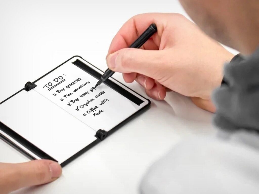 Open wallet with whiteboards and built-in pen for note-taking