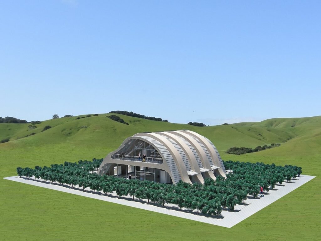 Facade of the Solar Vineyard House with concrete and glass arches reflecting the surrounding hills