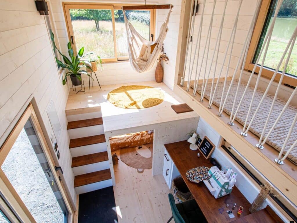 Exterior design of a small house featuring natural wood and black accents