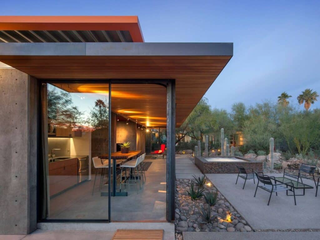 Renovated guest house in the Phoenix desert, blending heritage and modern architecture with minimalist interiors, natural materials, and landscaped outdoor spaces.