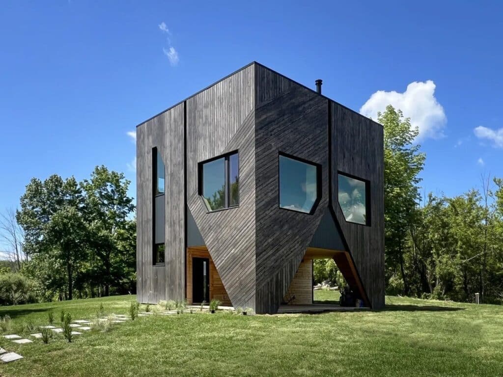 House on the Hill in Hudson Valley covered with cedar wood amidst the forest