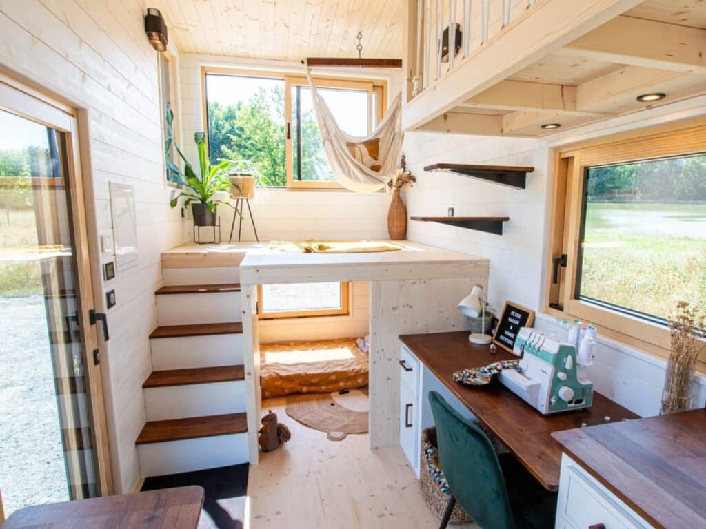 Exterior design of a small house featuring natural wood and black accents