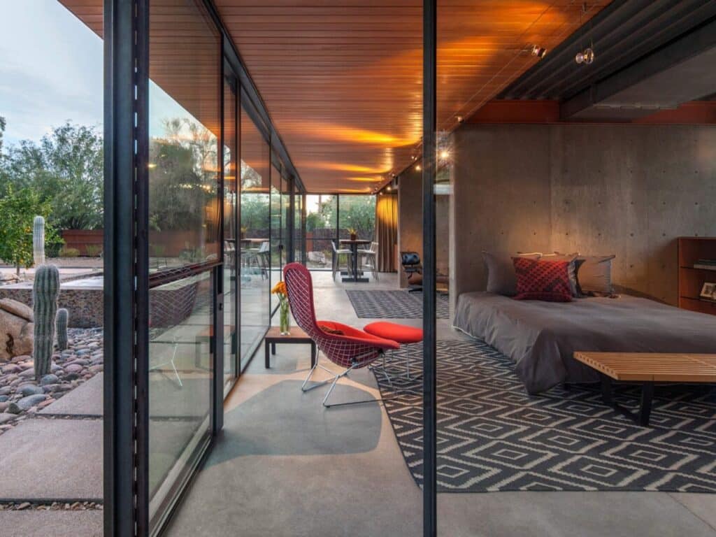 Renovated guest house in the Phoenix desert, blending heritage and modern architecture with minimalist interiors, natural materials, and landscaped outdoor spaces.