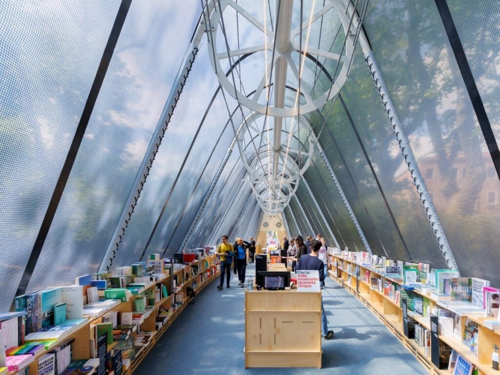 La Libreria mobile library resembling a greenhouse, surrounded by visitors