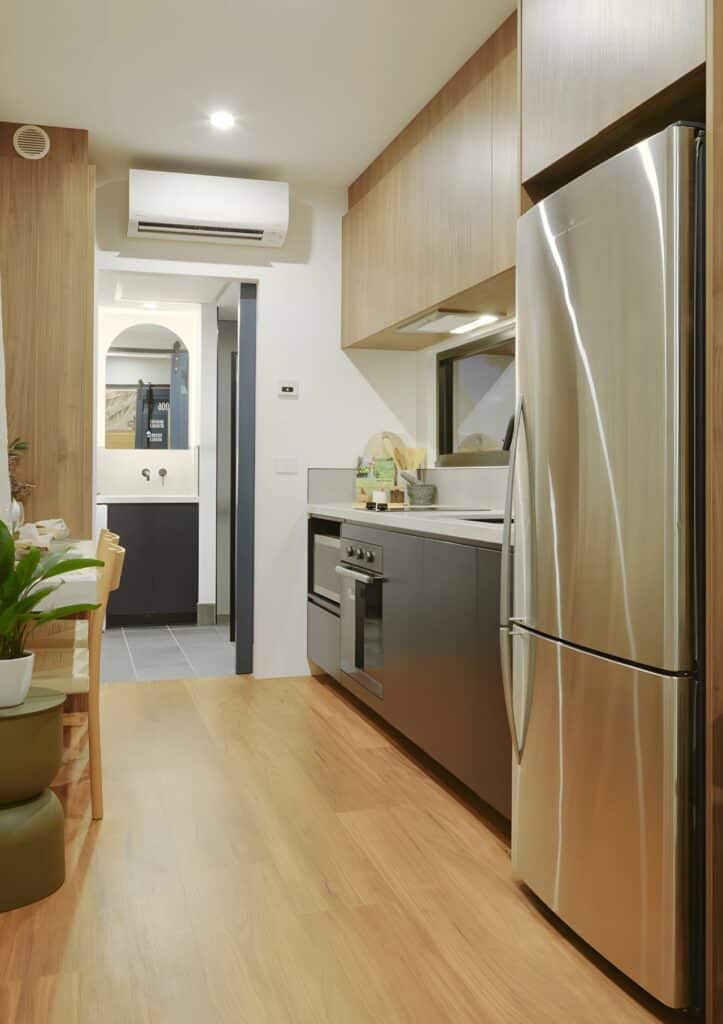 Fully equipped kitchen in Mark VI &ndash; VIC home with fridge, oven, induction stove, and storage space