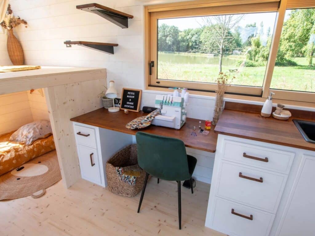 Exterior design of a small house featuring natural wood and black accents