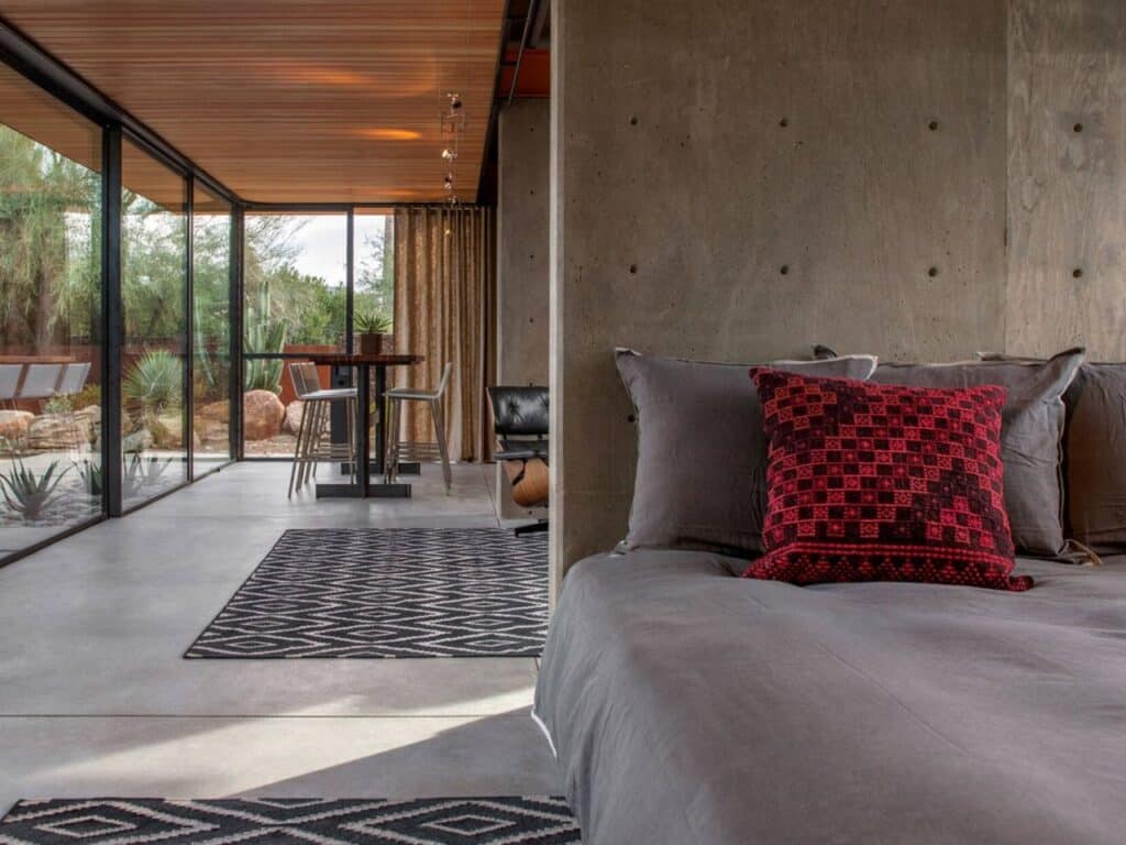 Renovated guest house in the Phoenix desert, blending heritage and modern architecture with minimalist interiors, natural materials, and landscaped outdoor spaces.