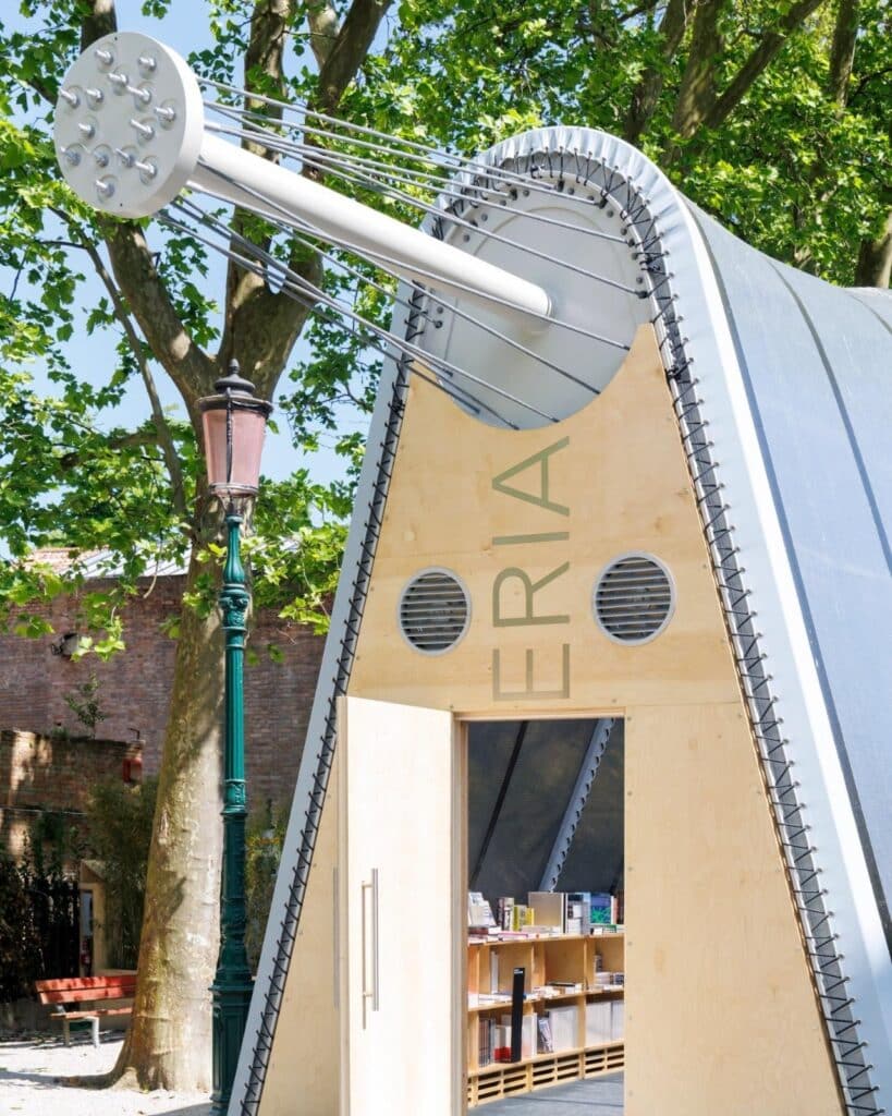 La Libreria mobile library resembling a greenhouse, surrounded by visitors