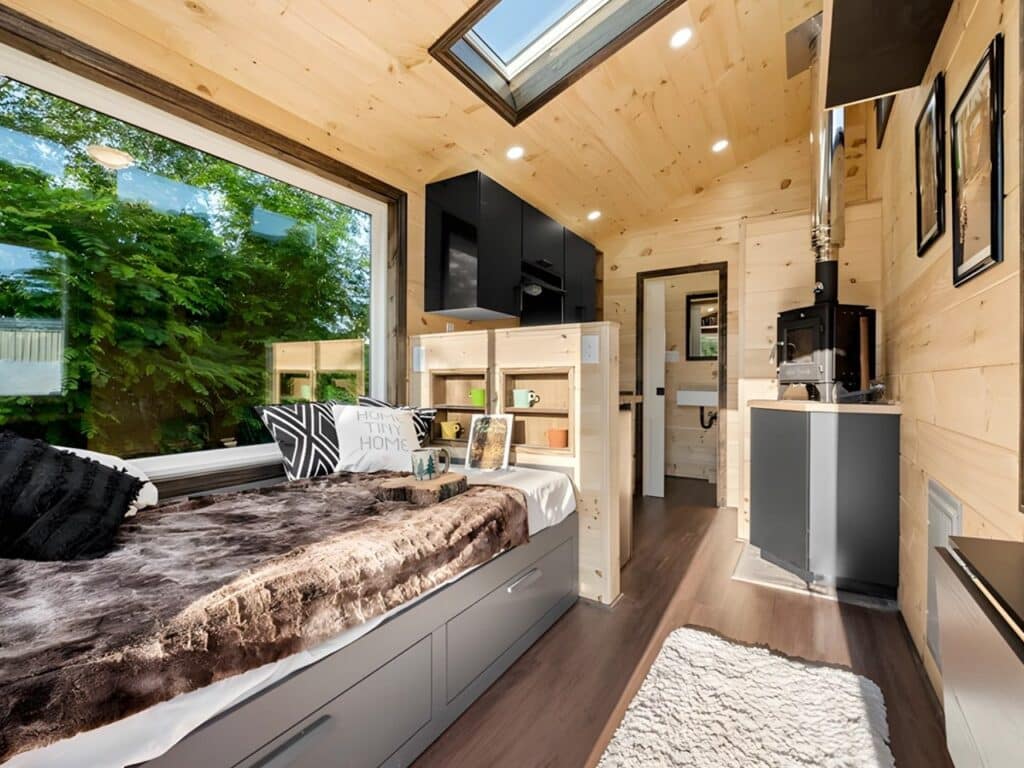 Exterior view of Little Lodge tiny home with wood and metal facade