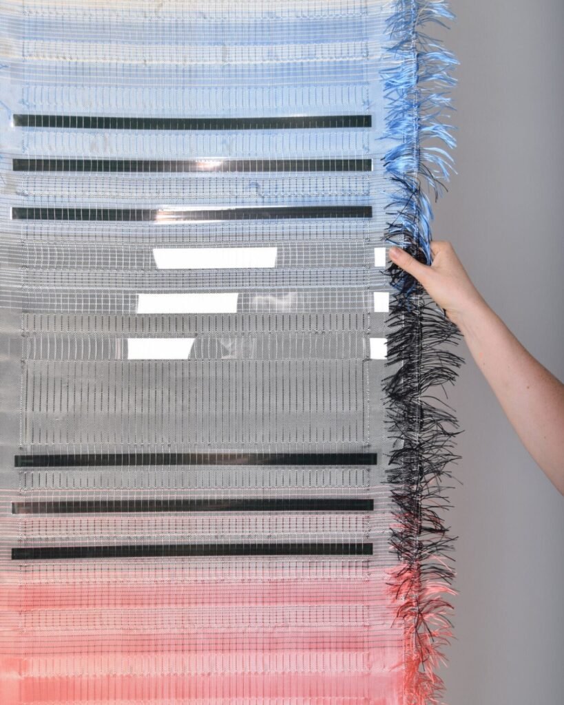 Umbra Pavilion facade with sky-blue roof and Heliotex solar materials