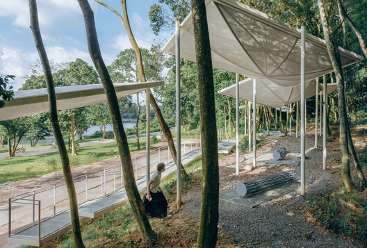 Semi-transparent floating pavilions within the local forest