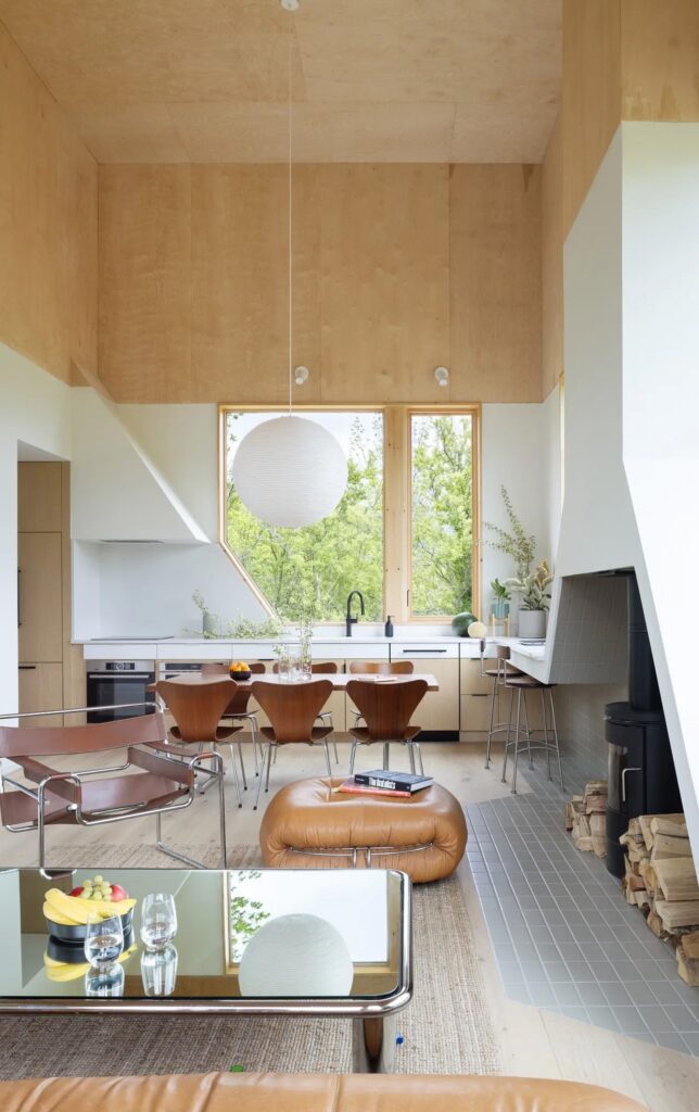 House on the Hill in Hudson Valley covered with cedar wood amidst the forest