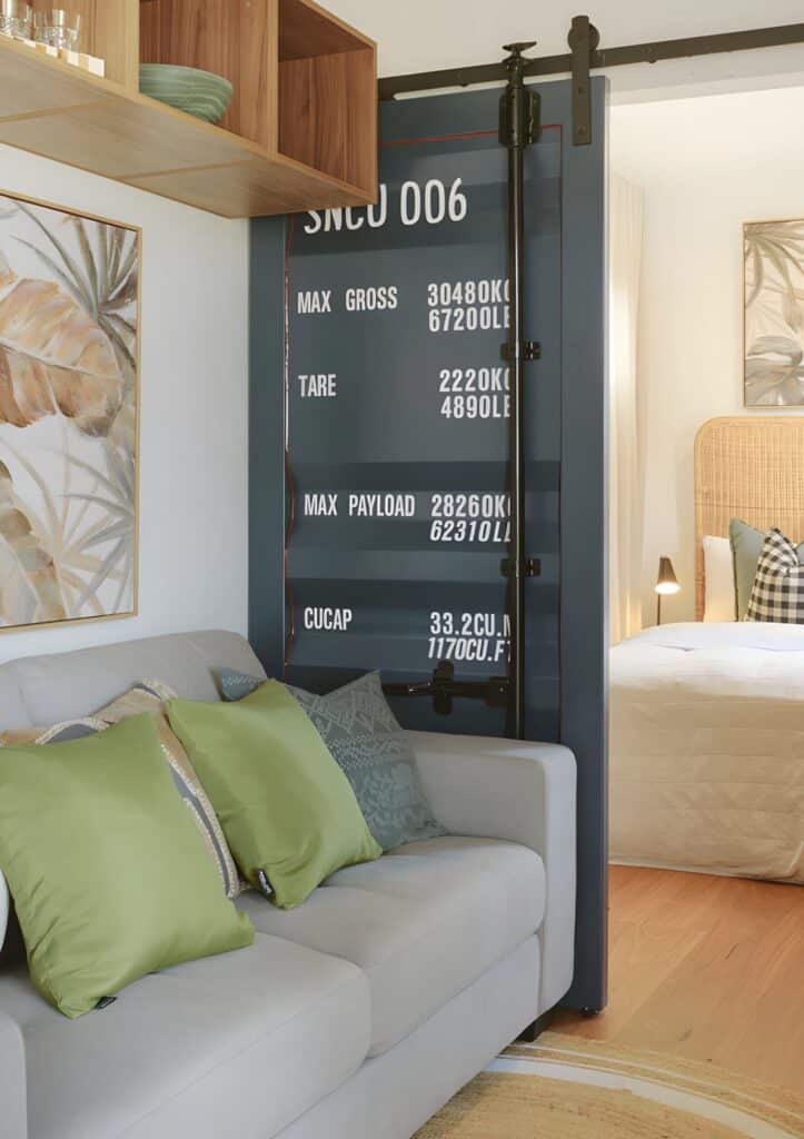 Central living area in Mark VI &ndash; VIC home featuring sofa, coffee table, and storage unit