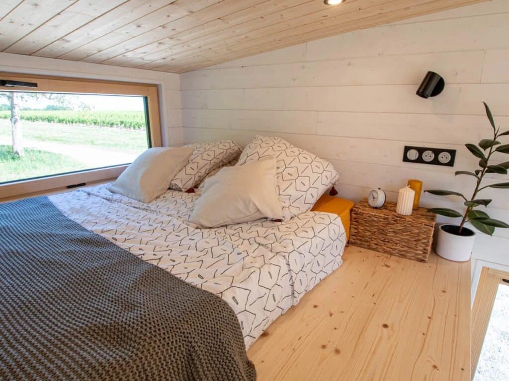 Exterior design of a small house featuring natural wood and black accents