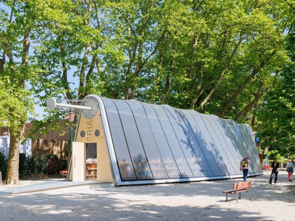 La Libreria mobile library resembling a greenhouse, surrounded by visitors