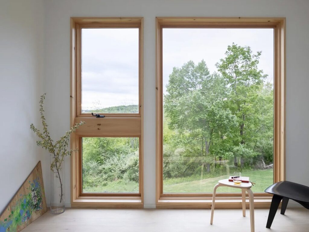 House on the Hill in Hudson Valley covered with cedar wood amidst the forest