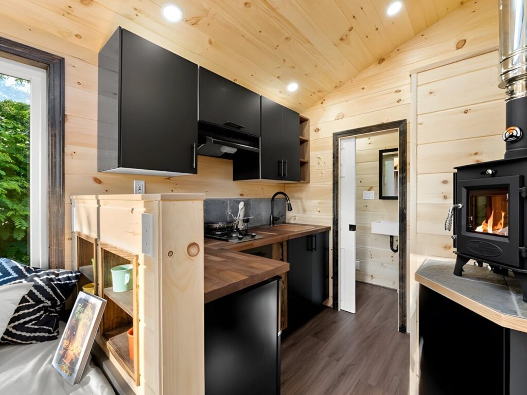 Exterior view of Little Lodge tiny home with wood and metal facade