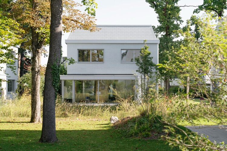 Overall view of Neubiberg residential quarter showing terraced buildings and green spaces