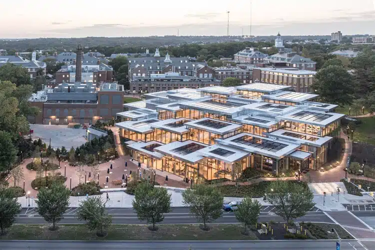 Bloomberg Student Center exterior view showing wooden structures and solar panels