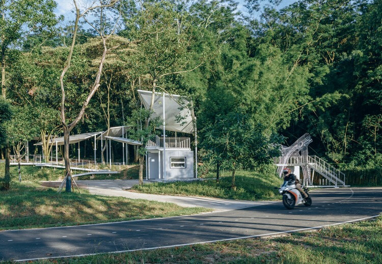 Semi-transparent floating pavilions within the local forest