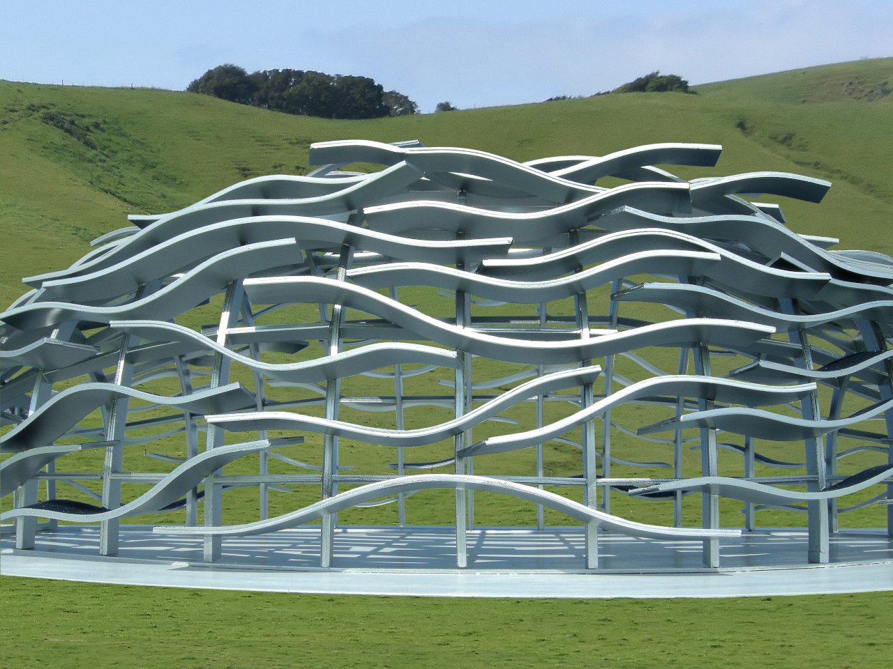 Solar Winds Pavilion exterior showing curved steel panels inspired by vineyard hills