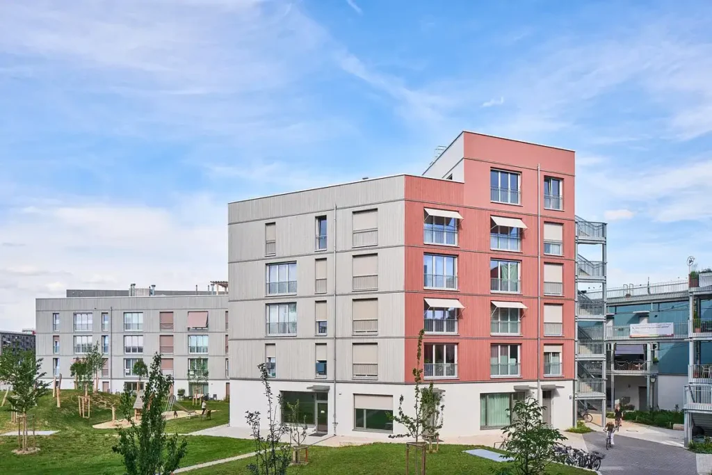 Aerial view of Ludlstra&szlig;e complex showing diverse building sizes, terraces, and internal bridges connecting spaces.