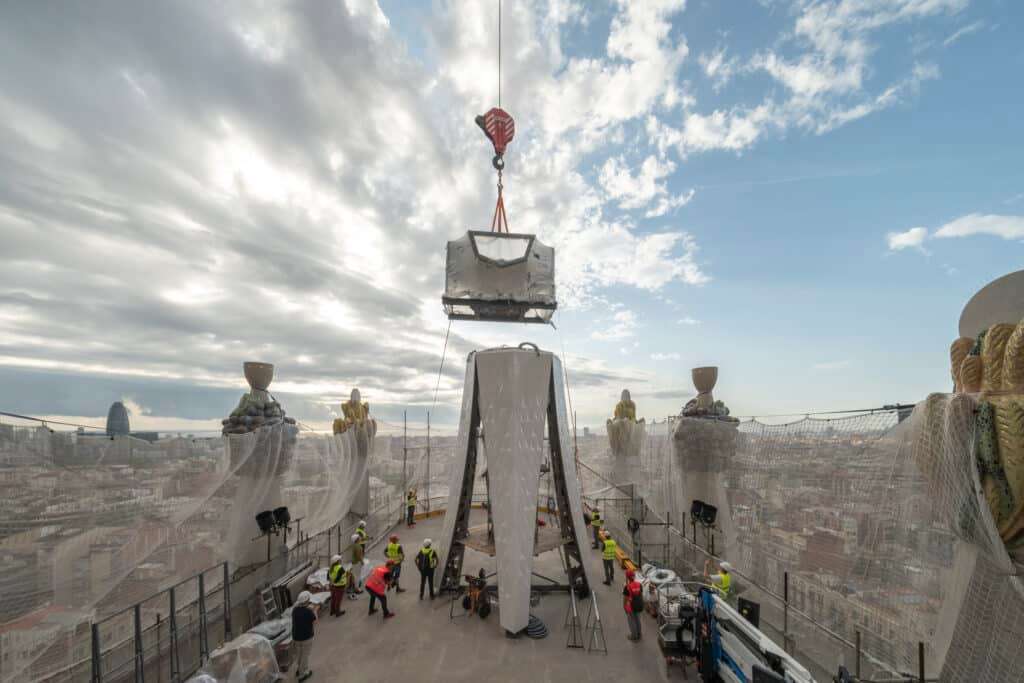 Installation of the lower section of the cross atop the Tower of Jesus Christ at the Sagrada Família