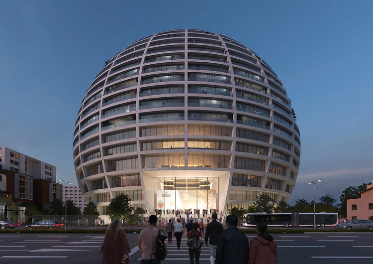 The spherical fa&ccedil;ade of Asllan Rusi Sports Palace in Tirana, showcasing the massive form and integration with the urban environment.