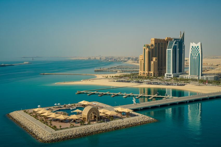 Walkways overlooking the sea immerse visitors in natural light and surroundings