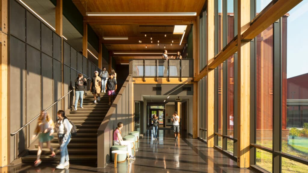 Wide staircase with natural light enhancing the visitor&rsquo;s movement through the interior.