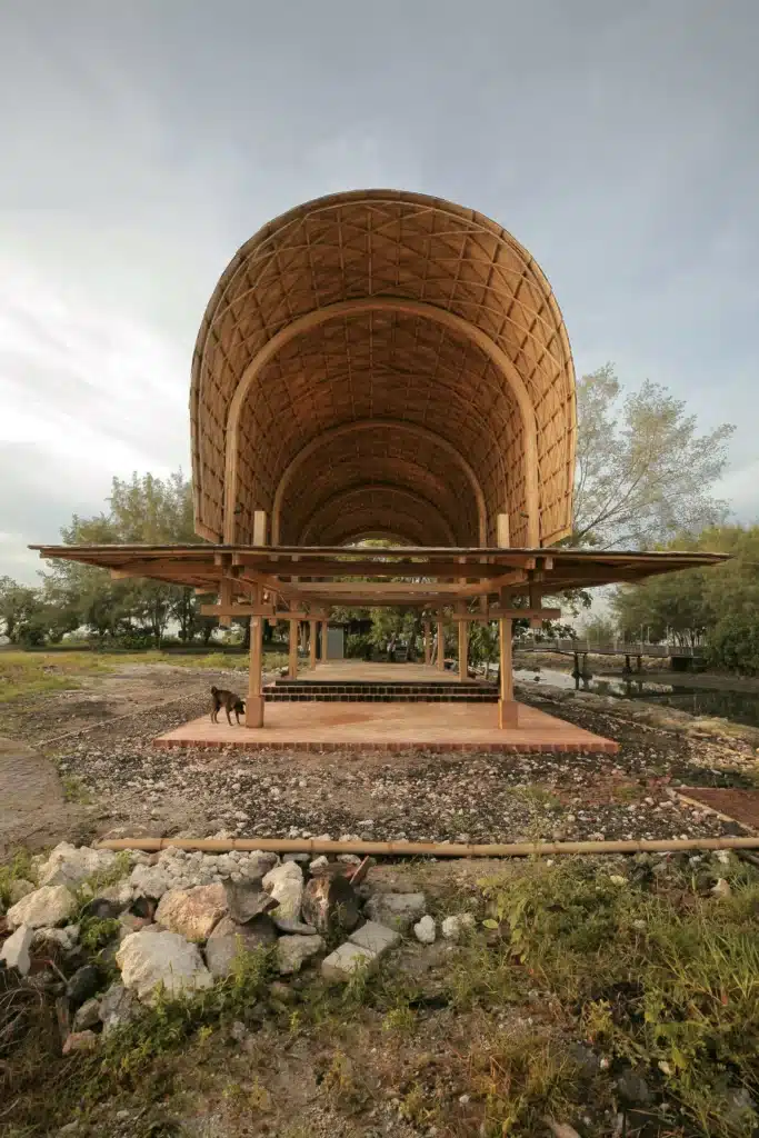 Interior open space of the pavilion showing light flow and natural ventilation under the vaulted roof.