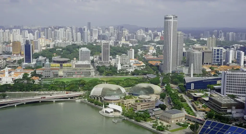 Aerial view of a modern metropolis where skyscrapers meet green lungs and waterways sustainable urbanism in motion.