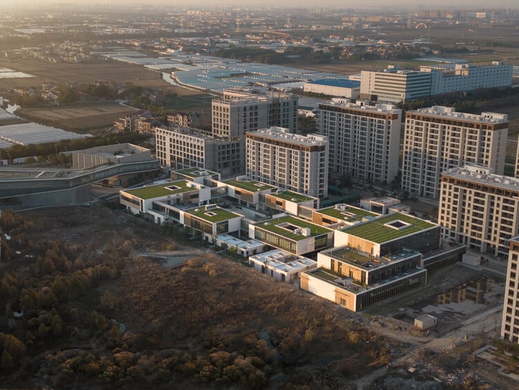 Open interior courtyard surrounded by buildings, featuring green spaces and walking paths within the retirement community.
