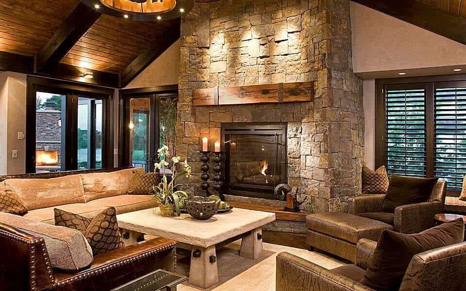 Wood and stone house harmonizing with surrounding hills under natural light