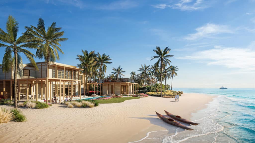 فيلات ومنتجعات على جزيرة لاحق محاطة بالمياه الزرقاء، مع ظهور الجسر في الخلفية.