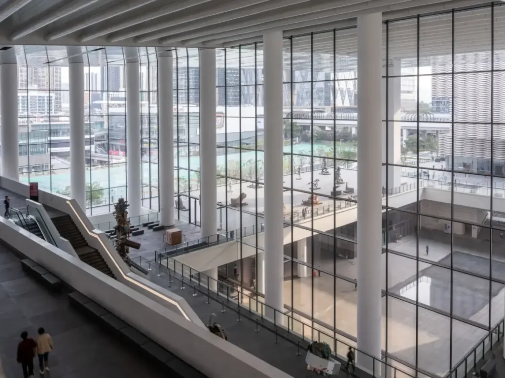 The museum’s glass atrium overlooking the city and entrance plaza