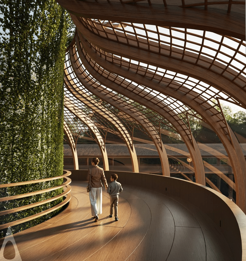 A woman and child walk along a curved wooden path under a flowing timber canopy, beside a living green wall, bathed in warm sunlight.