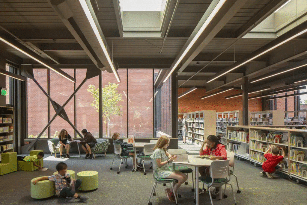 A picture of a library inside the school, with students enjoying themselves.