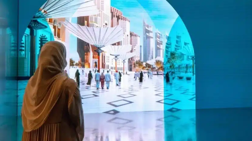 A woman gazes at a glowing scene through an arch, where light flows and reflects on the pristine floor.