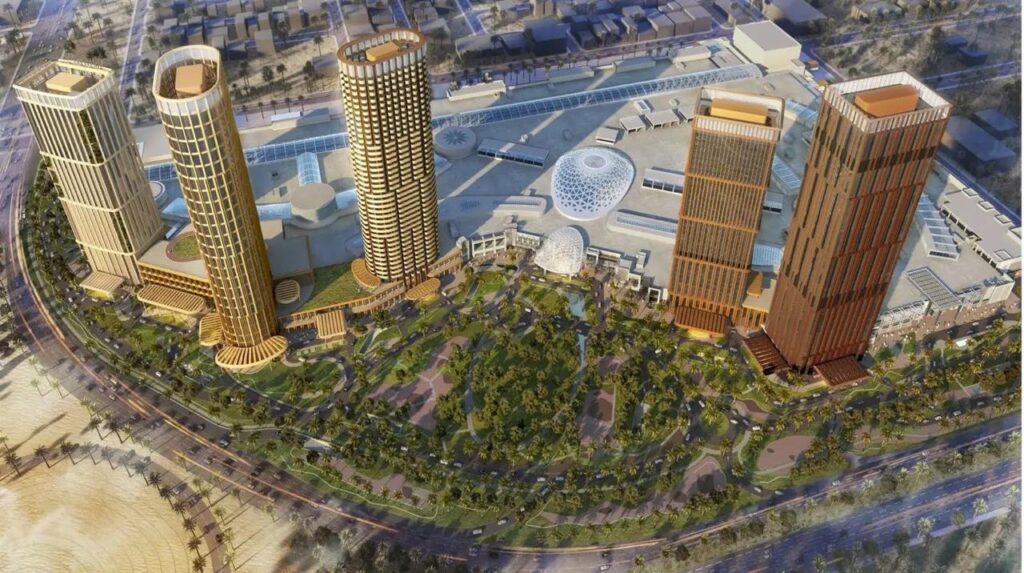 منظور جوي لمشروع ألافيونز الرياض، يبرز توزيع الأبراج السكنية والفنادق حول المركز التجاري، مع حدائق وطرق محيطة.