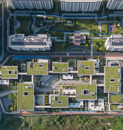 Side view of buildings featuring open movement pathways and indoor/outdoor seating areas