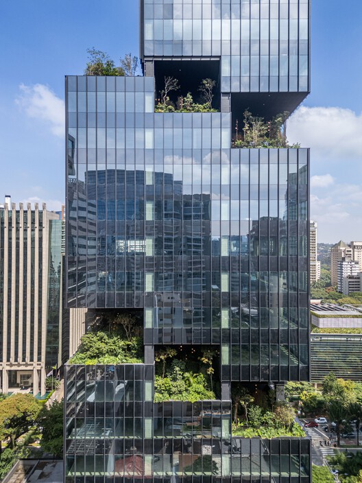 Salma Tower terraces with dense vegetation and pathways within the vertical forests