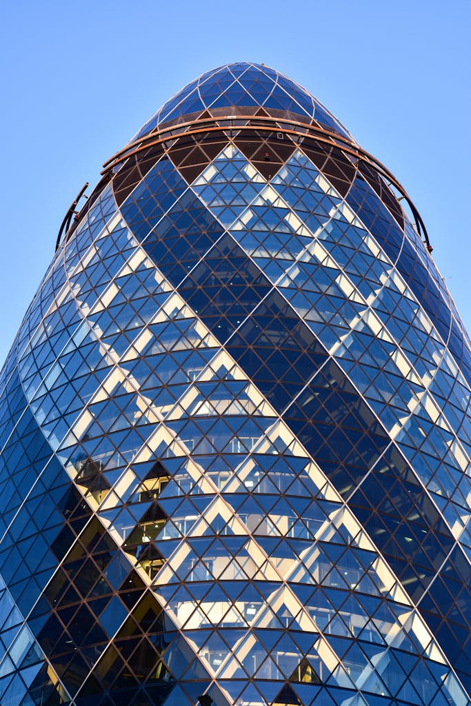 Close-up view of the modern Gherkin building's architectural design in London, England.
