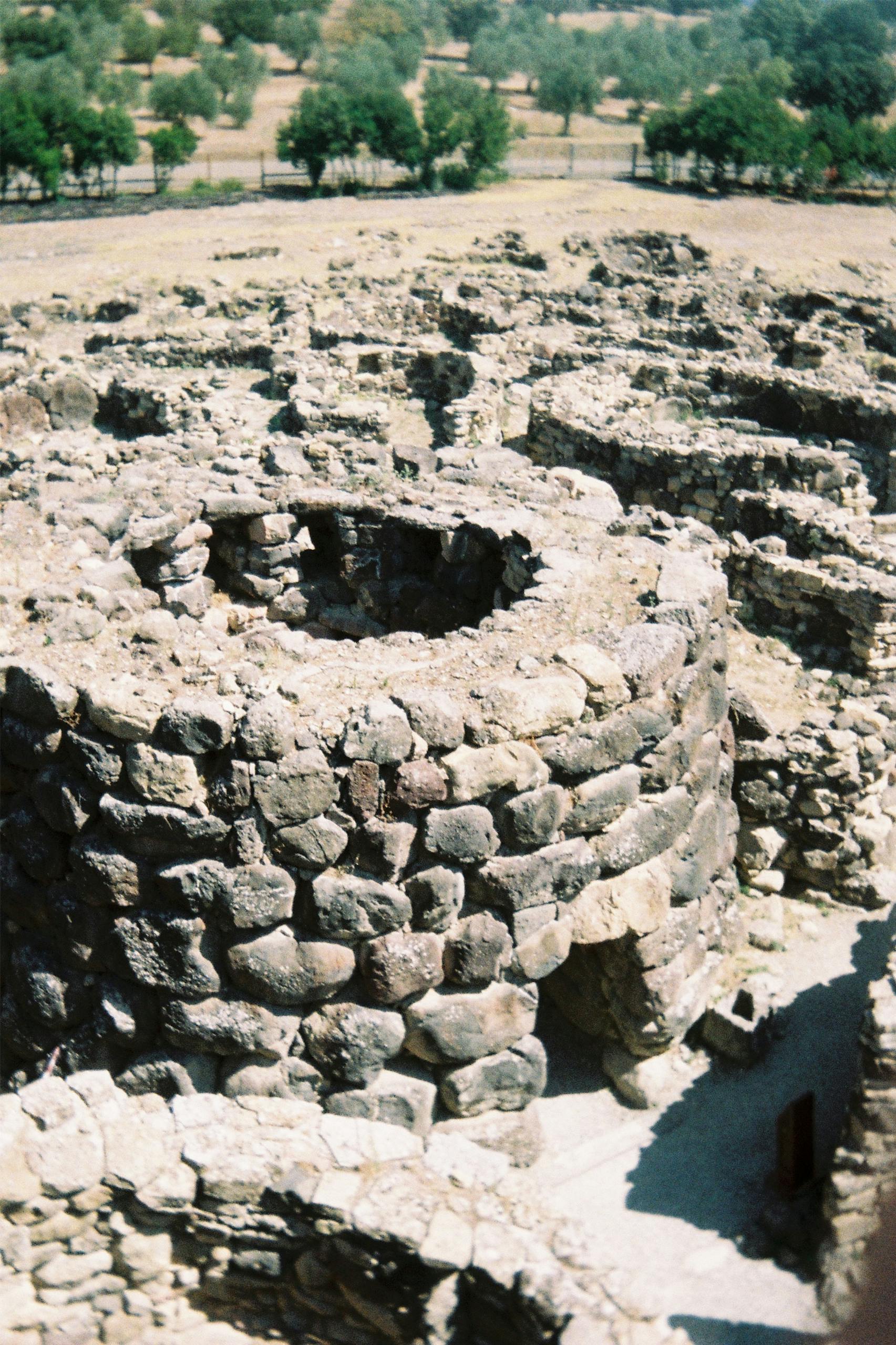 Explore the ancient Nuraghe stone ruins in Sardinia, a marvel of prehistoric architecture.