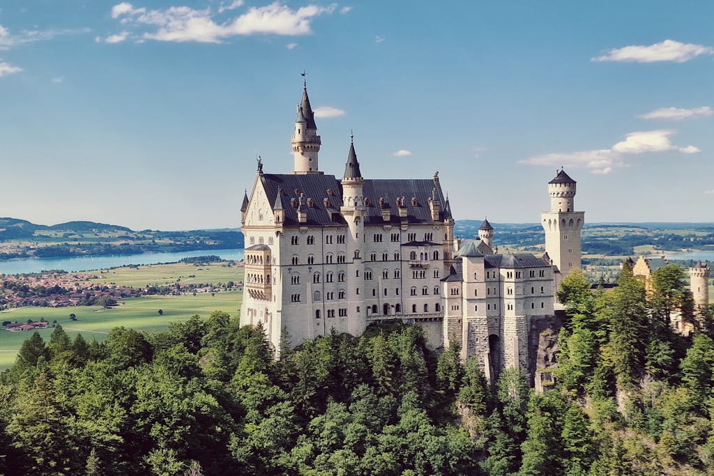 Explore the iconic Neuschwanstein Castle set against the scenic backdrop of Bavaria, Germany.