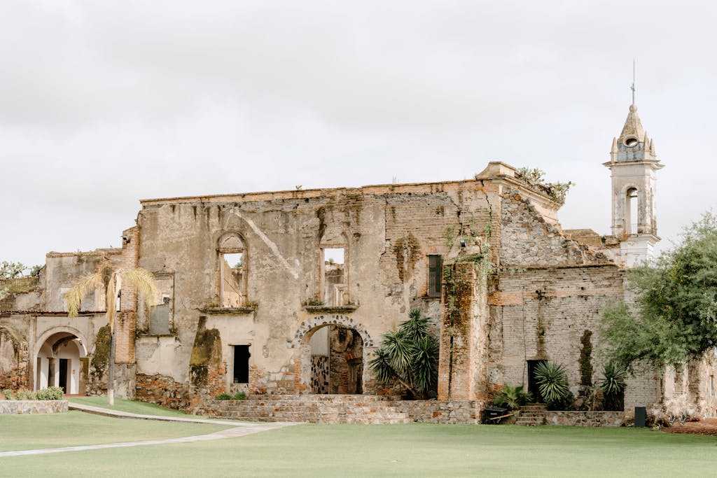 Explore the weathered ruins of an ancient church set against a bright outdoor backdrop.