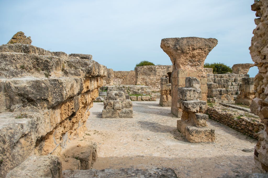 Famous remains of old historic stones with ruined columns located on street against cloudless sky located in Tunisia in Turkey
