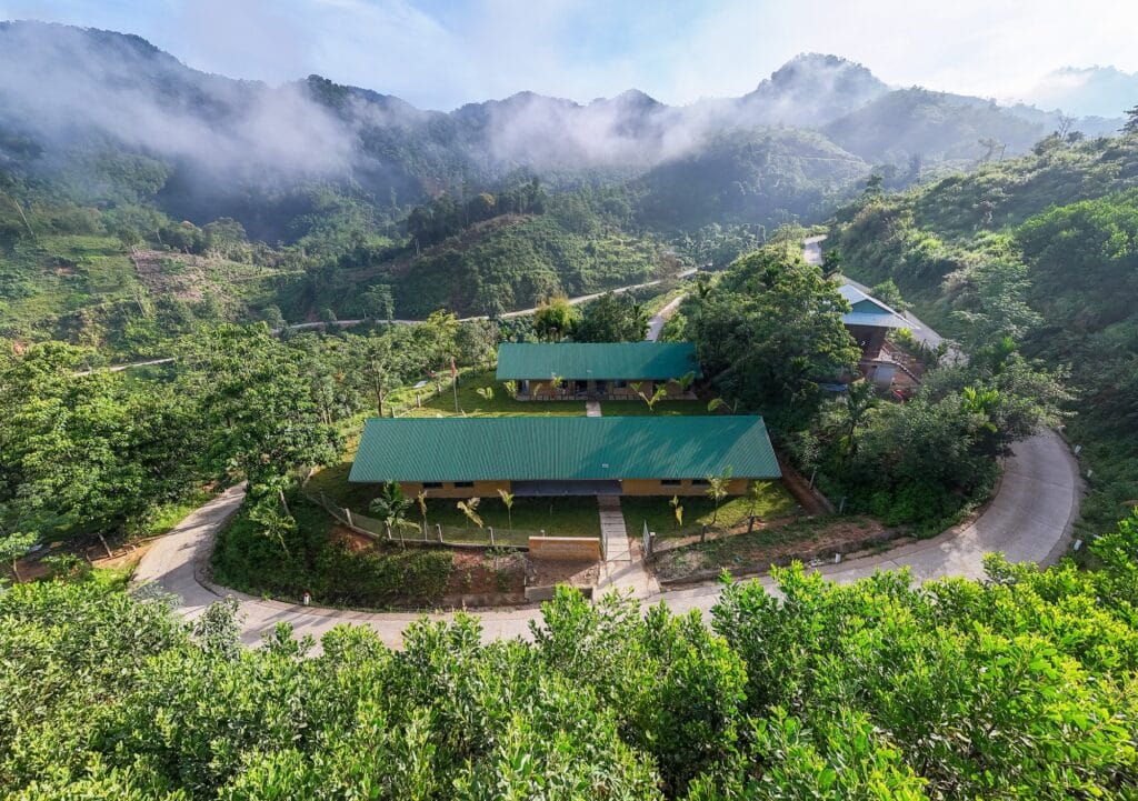 Nuoc Ui School located in the remote mountainous area of Tra My, highlighting rugged terrain and natural surroundings.