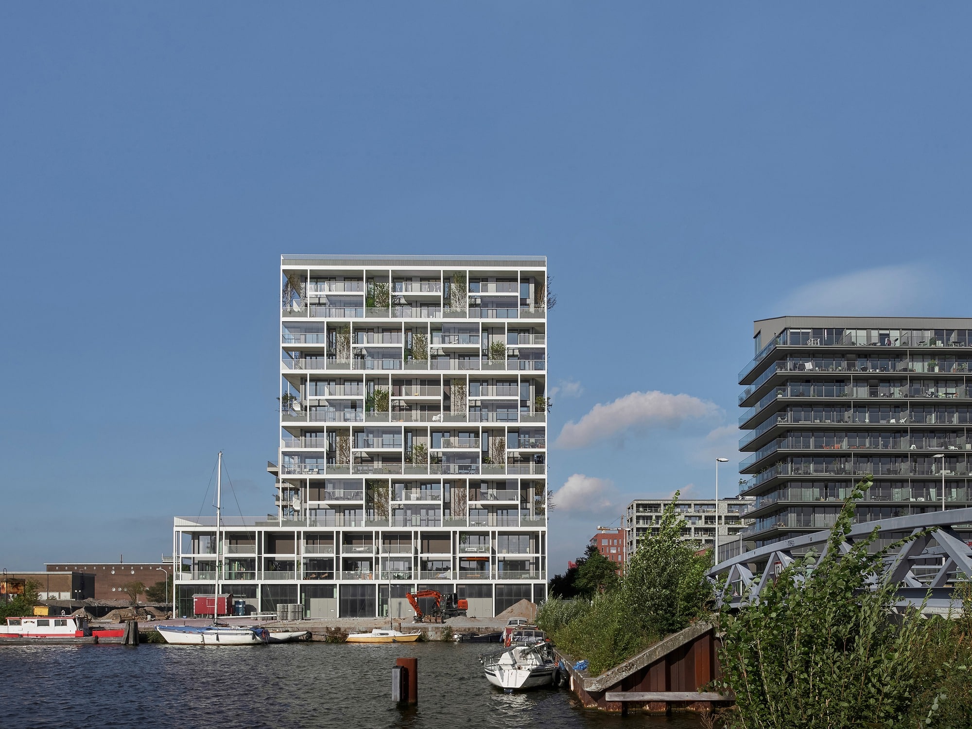 Stories project building in Amsterdam with cross-laminated timber façade and vertical greenery
