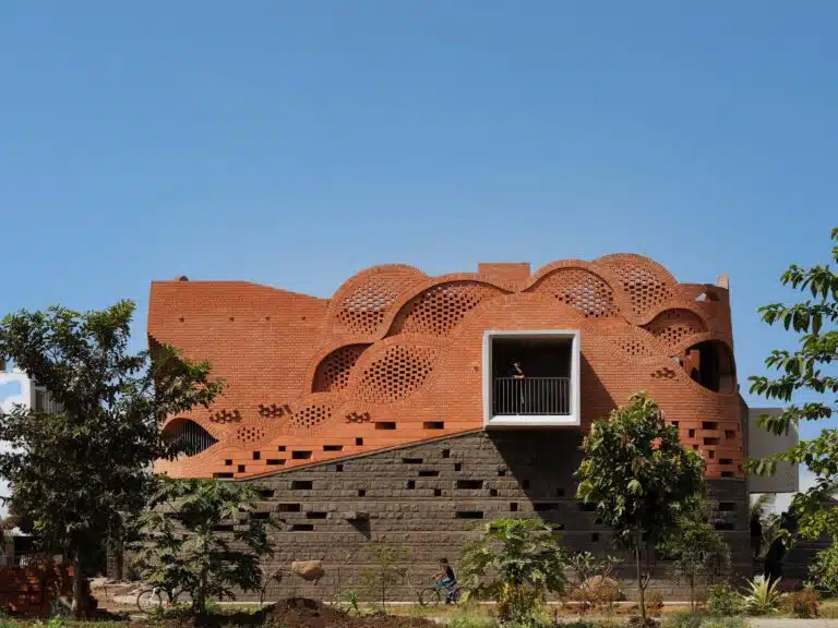 Maratha Sardar heritage house integrating traditional 'Wada' architecture with modern design, sustainable features, and self-sufficient living spaces.